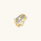 Triple-band gold ring with spherical bead chains and two crystal-pavé bars on cream background