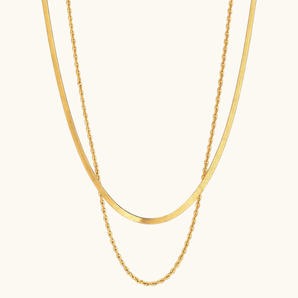 NYXA Dipped in Gold Duo layered necklace with flat herringbone and French rope chains in gold-plated stainless steel.